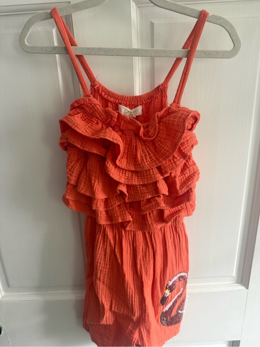 Poof! Coral/orange Ruffle Romper with Sequin Swan